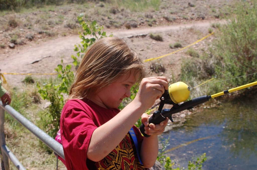 Jack Selden fights the tug of a rainbow trout.
