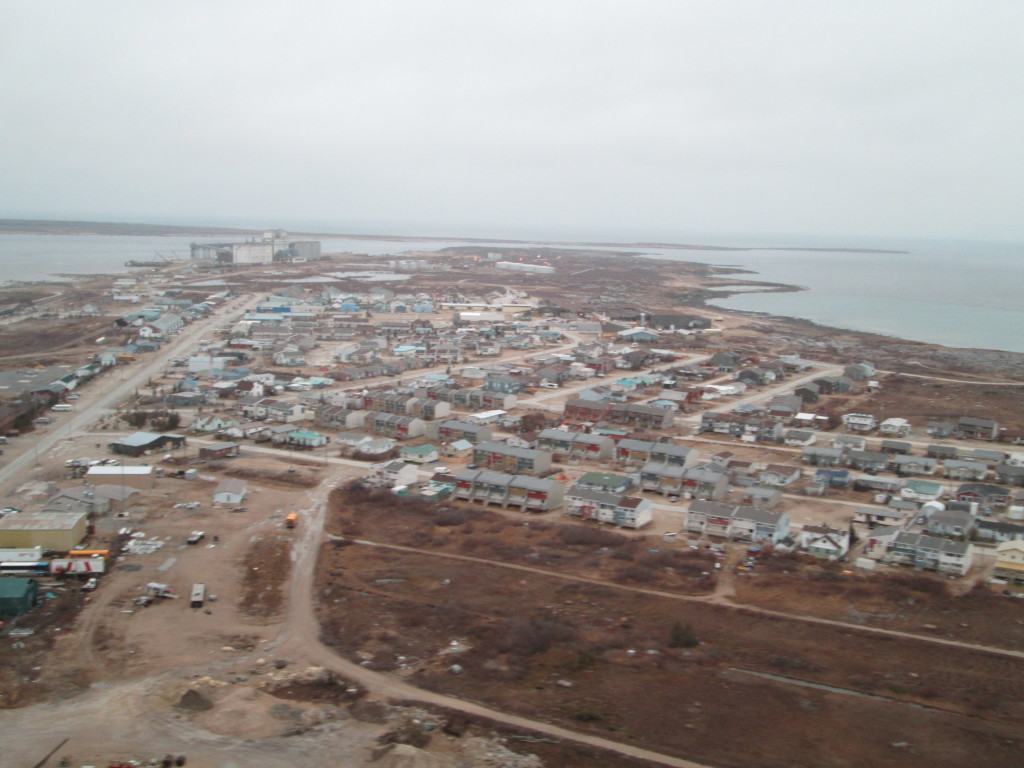 Traveling by helicopter to a polar bear den the traveler gets a view above Churchill, Manitoba.