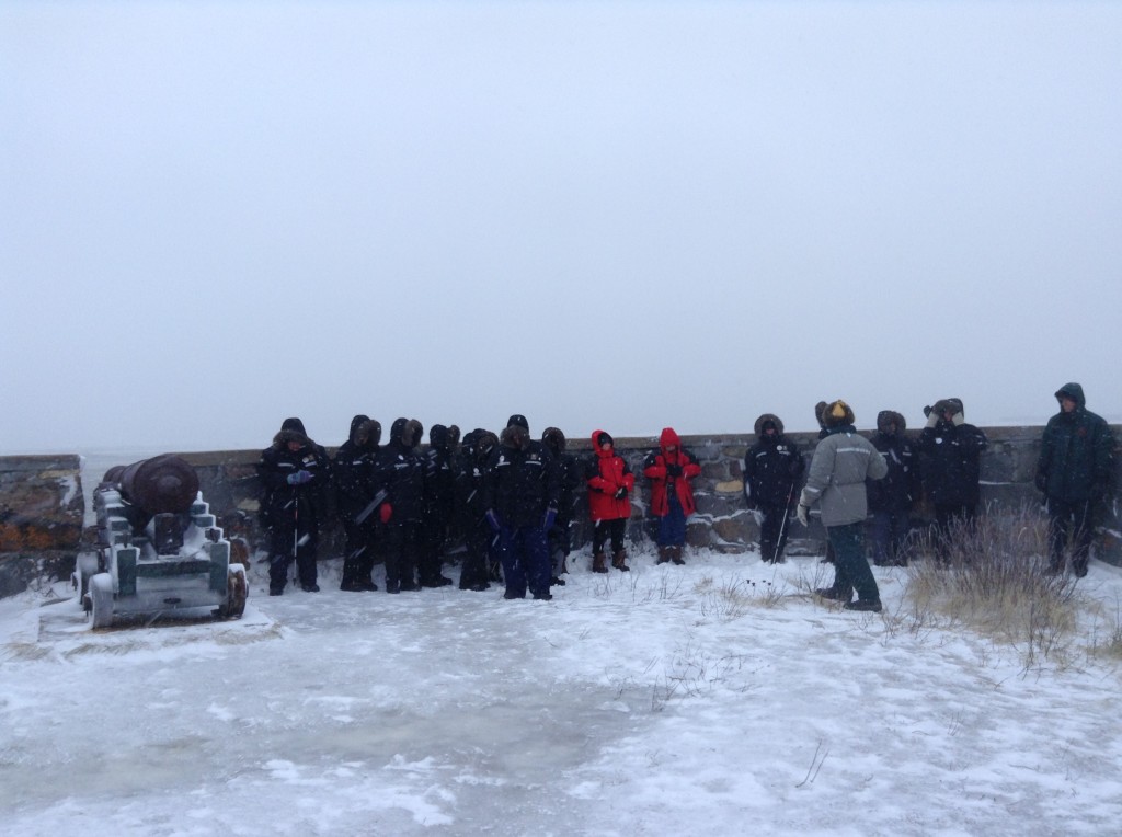 A group of Natural Habitat travelers at the battery outpost on Cape Merry.