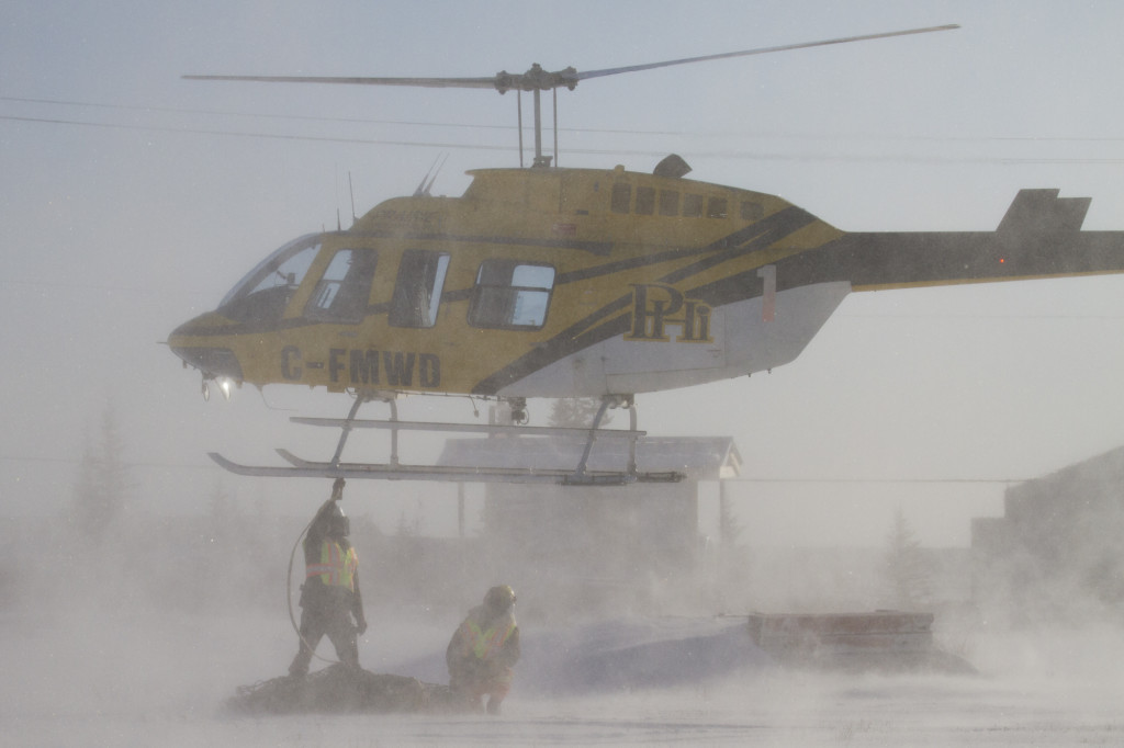Hudson Bay helicopters transports bears northwest from the polar bear compound in Churchill, Manitoba.