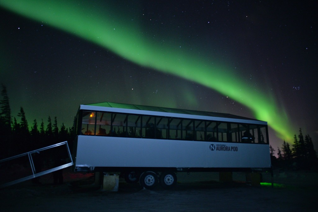 Natural Habitat Aurora Pod with northern lights.
