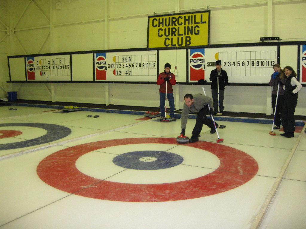 Natural Habitat travelers enjoy a curling experience in Churchill. Karen Walker photo.