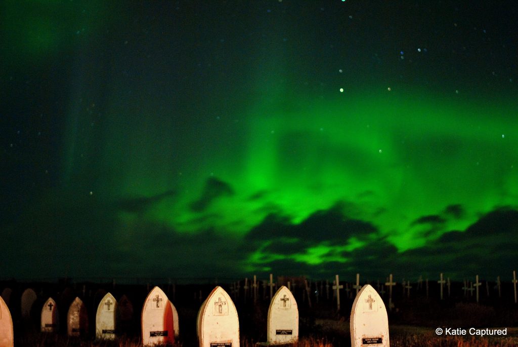 Churchill graveyard and aurora borealis.