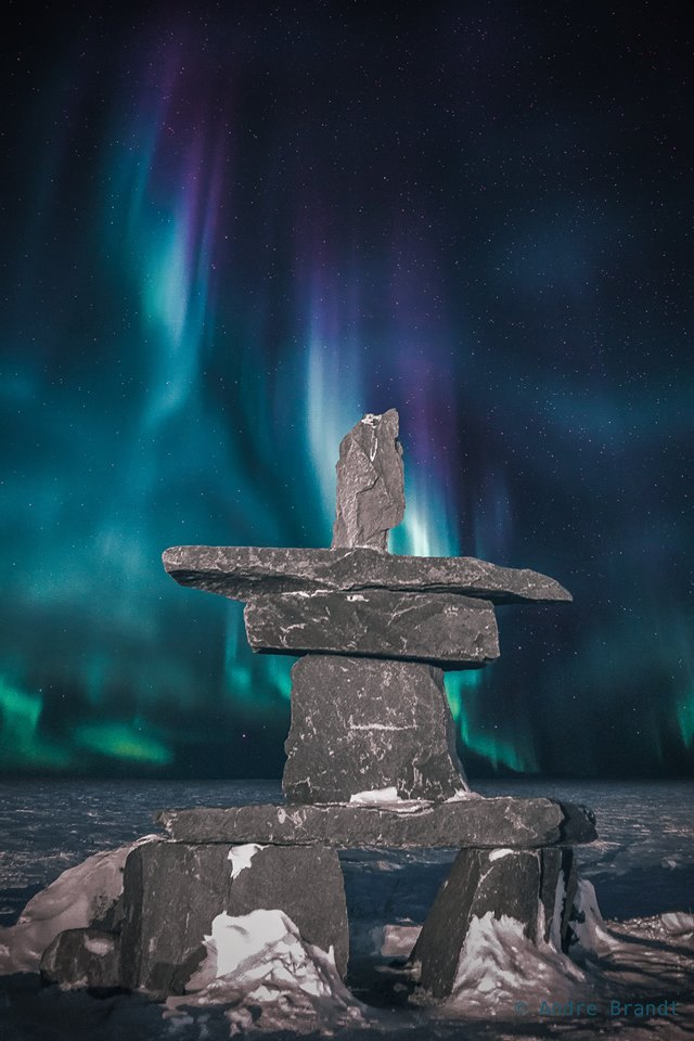 Churchill inukshuk northern lights