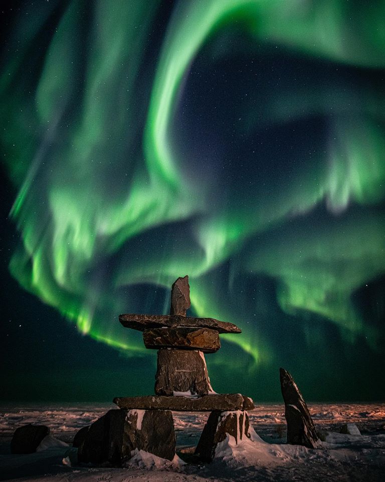 Inukshuk and northern lights in Churchill